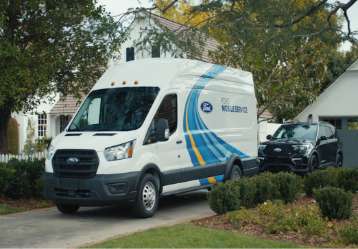 Ford mobile service van parked at a residential home